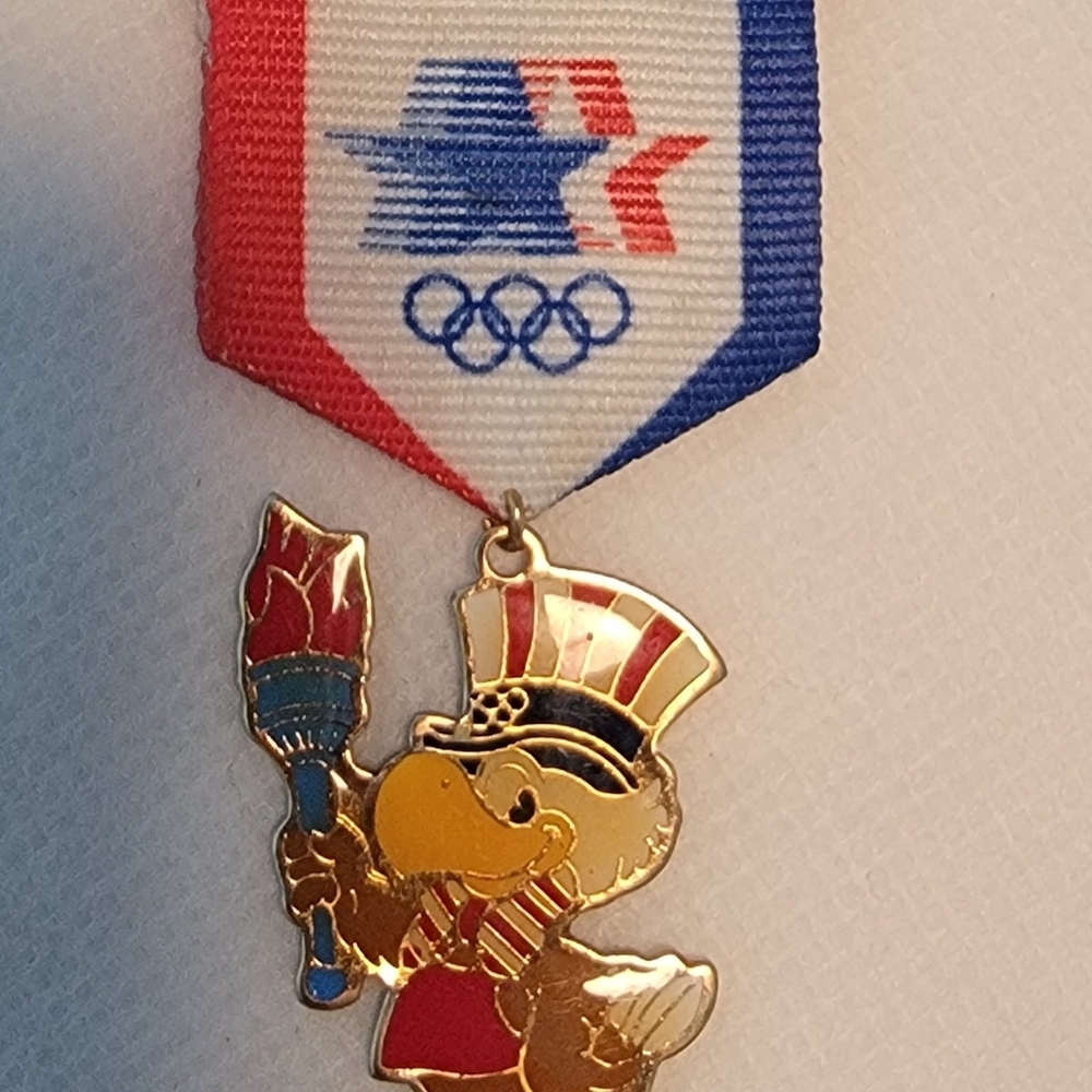 Vintage 1984 Olympic Mascot Pin with Ribbon